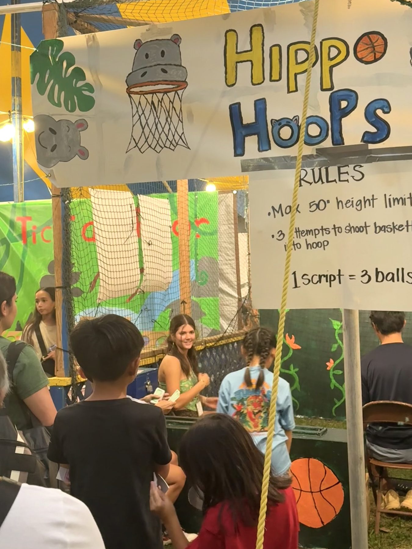 Stella working the Hippo Hoops booth at Punahou Carnival
