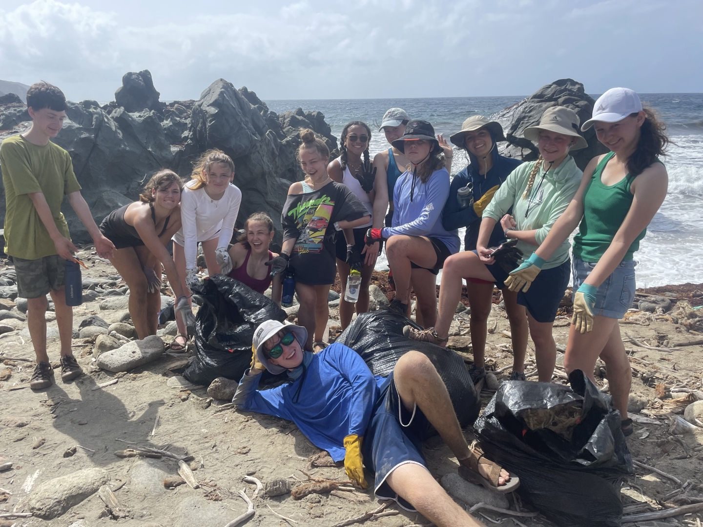 Crew after a coastal cleanup on a rocky British Virgin Islands beach