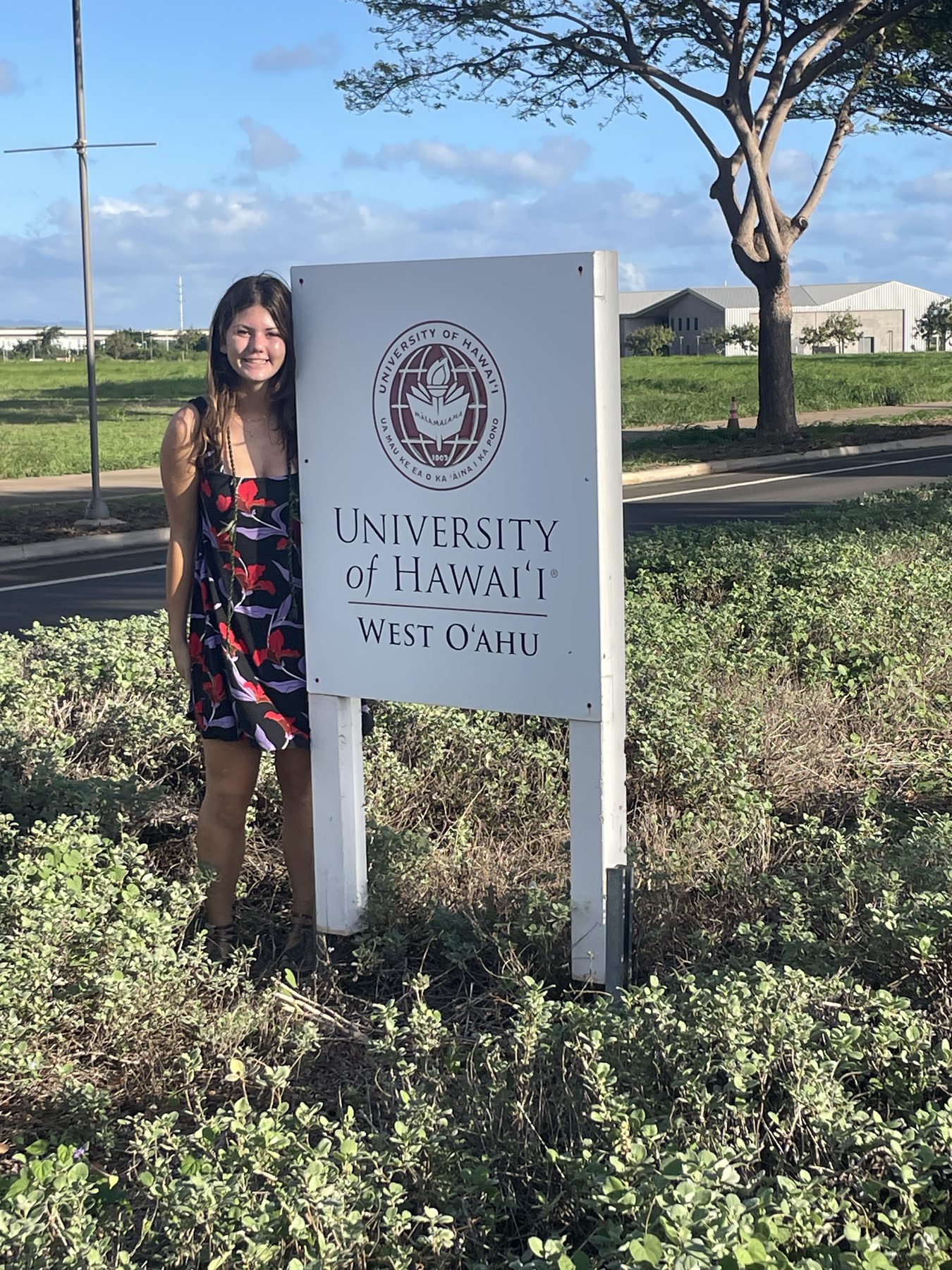 Stella at the University of Hawaiʻi West Oʻahu sign