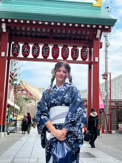 Stella in a yukata at a red shrine gate in Tokyo
