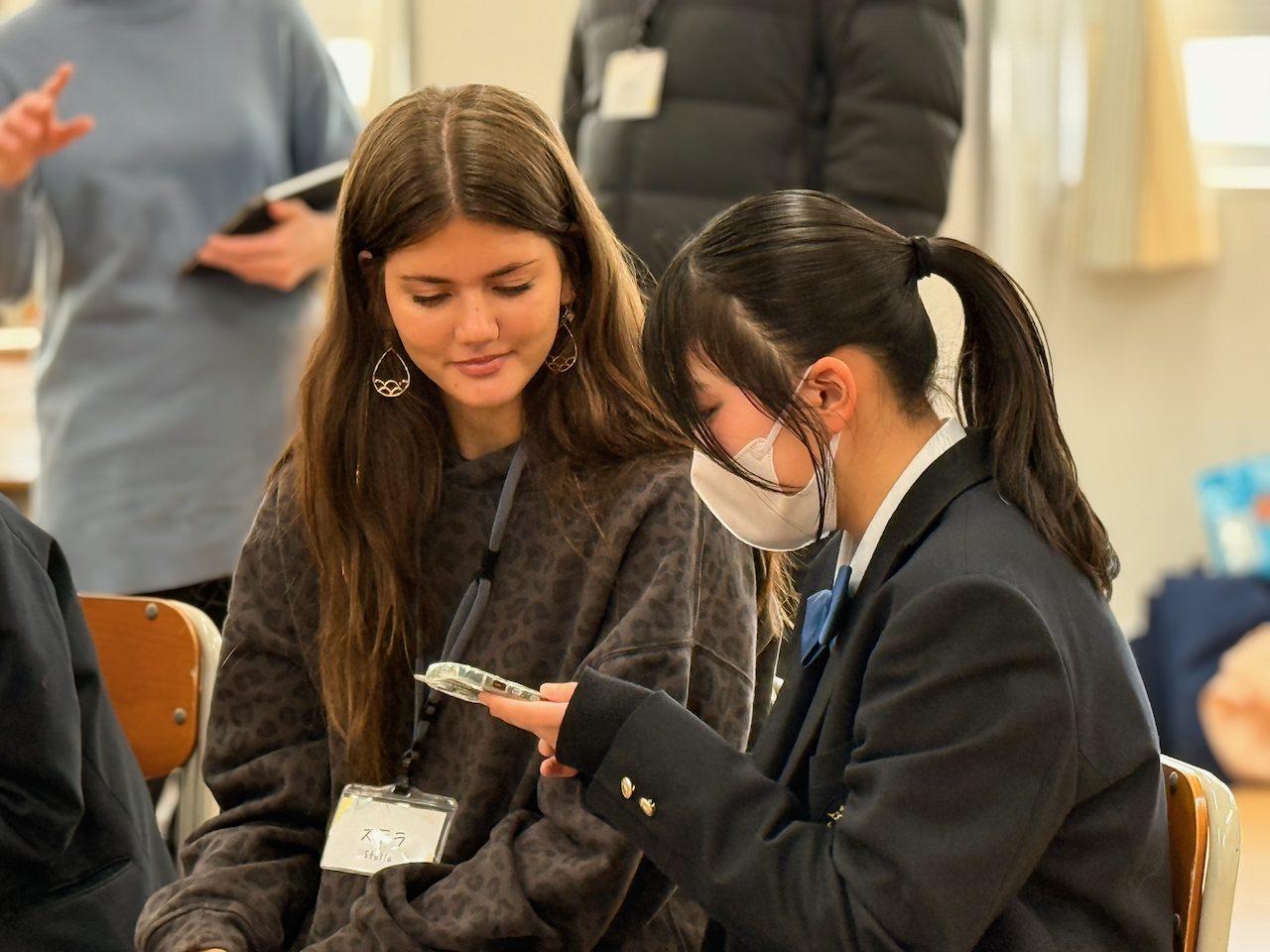 Stella talking with a Chino high school student