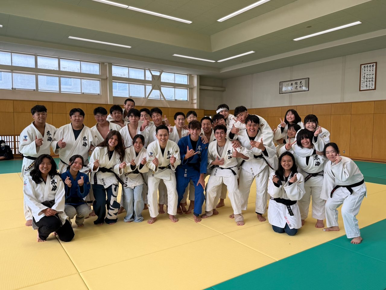 Judo club group photo on tatami mats in Chino